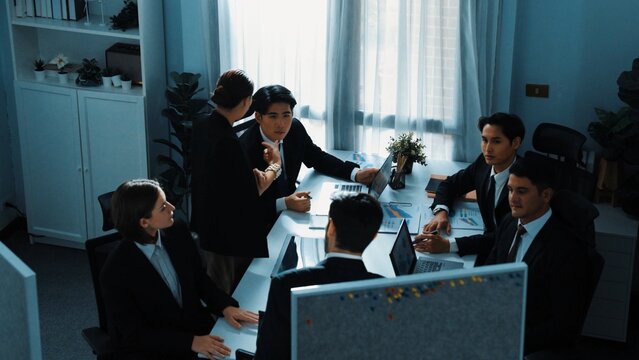 Top view of diverse business people brainstorm marketing idea while marketing team analyst stock market investment. Group of skilled project manager solving problems and sharing plan. Directorate.