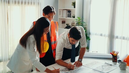 Top view of skilled business man and smart colleague design house together. Aerial view of...