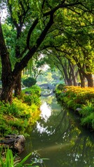 Lush park scene with a serene stream flowing under a canopy of green