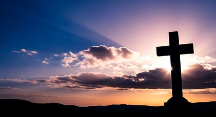 Cross silhouette against a vibrant and dramatic sunset sky with radiant sunbeams breaking through clouds, symbolizing hope, faith, spirituality and reflection.