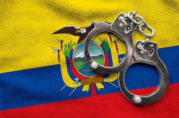 Flag of Ecuador and police handcuffs. Crime and offenses in country Concept
