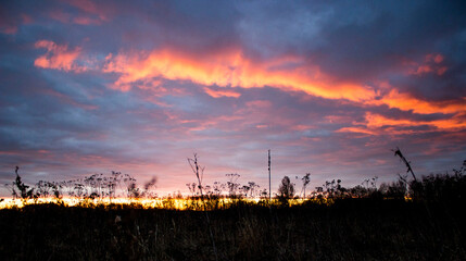 dawn with fiery clouds. red clouds. at sunset. a natural phenomenon. landscape.