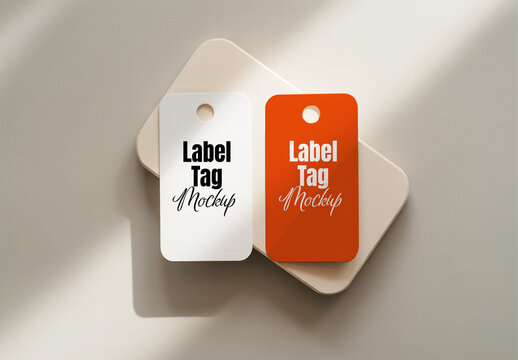 Two Hanging Label Tag Mockups on Abstract Surface