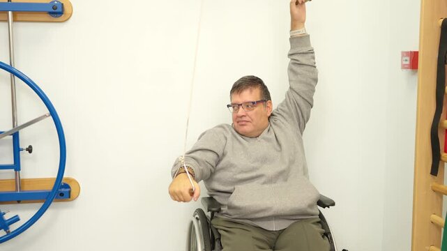 Determined man with a physical disability doing physiotherapy exercises