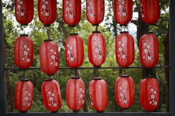 Beautiful festive display of red chinese lantern decoration. traditional hanging lanterns with...