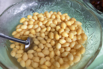Delicious asian dessert with sweet ginkgo nut seed ingredient in clear glass bowl. This traditional chinese food healthy and refreshing sweet soup for enjoyment