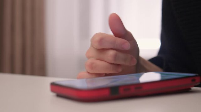 Nightly hand gestures on smartphone, Fingers tapping and engaging with phone during night hours, Closeup shot capturing hand movements interacting with mobile device at night