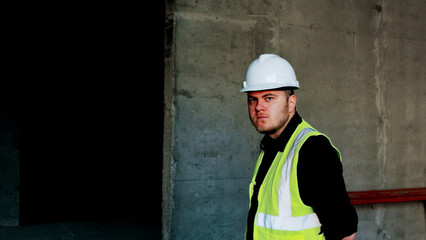 The site manager is inspecting the progress of the building construction