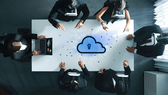 A dynamic business team collaborates in a modern office setting, using virtual reality headsets to explore cloud security and data protection strategies effectively. Trope