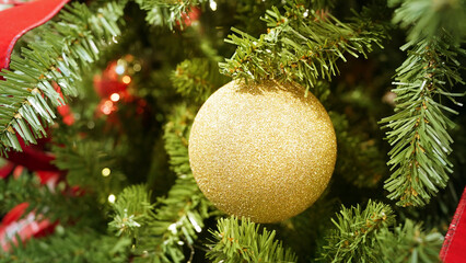 Sparkling Christmas ornaments decorating lush holiday tree