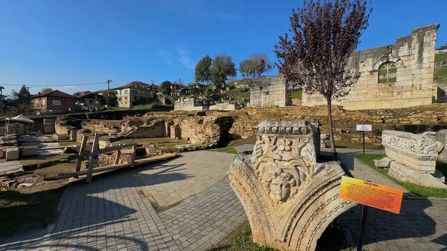 4K video of a stone architectural fragment featuring the head of Medusa. Located at the Prusias ad Hypium ancient city excavation site in Duzce, Turkey.