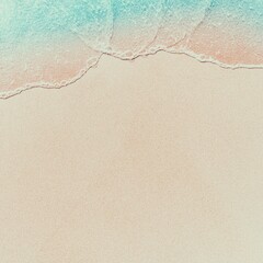 Minimalist beach scene with copy space, featuring the waterline where the clear blue water meets the soft sand. Ideal for travel and holiday promotions.