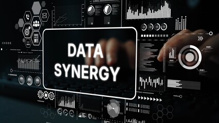 Hands on Keyboard with Data Synergy Concept, Graphs, Charts, and Digital Interface Elements in Background. Asymptotic smart data analytic.