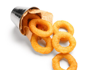 Metal bucket with fried breaded onion rings on white background
