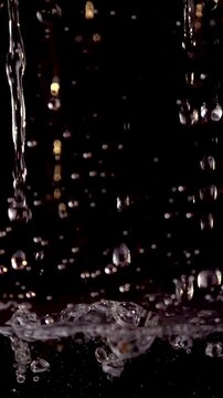 Experience Mesmerizing 1000 Fps Slow Motion of Pure Water Drops in Stunning 4K Vertical Format