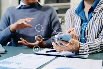 Working team meeting concept, business using laptop and smart phone and digital tablet computer with digital marketing media  in virtual icon network diagram office