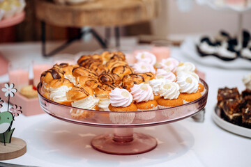 Candy bar of different cookies, candy and sweets at party