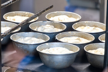 Baking of Polenta e Osei di Bergamo Alta, most renowned sweet specialty of Bergamo’s cuisine, made from sponge cake, chocolate, butter, hazelnut creams, rum