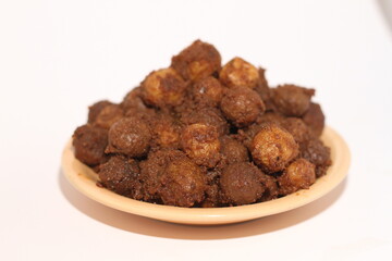 Potato rendang served on a plate, Rendang is a typical Padang food. With a white background