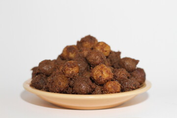 Potato rendang served on a plate, Rendang is a typical Padang food. With a white background