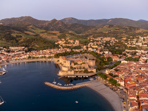 Early morning aerial view of colourful Collioure, narrow streets, summer vacation destination town with historical buidings, beaches, Pyrenees-Orientales, France