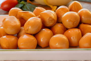 Cheese collection, smoked yellow italian mini scamorza or scamorzella cheese