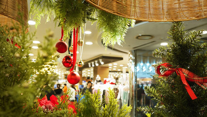 Busy Christmas shopping scene in brightly decorated mall during holiday season