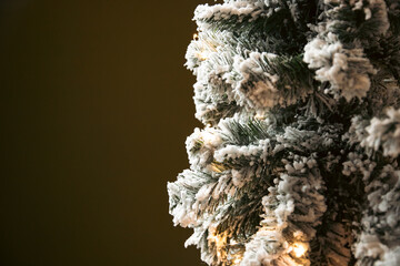 Christmas tree with snow and red balls and copy space.
