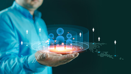 Businessman using CRM to analyze customer behavior allows businesses to refine marketing strategies and boost sales effectively. Customer relationship management concept. Icon on virtual screen