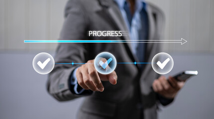 Businessman using check mark on checklist with progressive loading status to remind work in progress for project development management and idea tracking.
