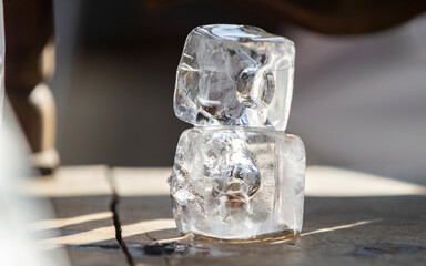 Ice cube close-up on the table, shallow depth of field