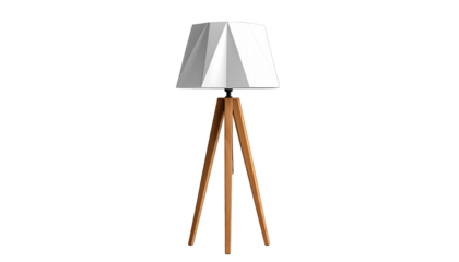 A geometric lampshade on wooden tripod legs against a black background