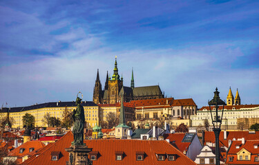 Obraz premium Prague Castle and Charles Bridge at Sunset, Historic European Landmark with Gothic Spires, Red Roofs, Cultural Heritage, Czech Republic