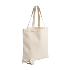 Pristine, empty, light beige cotton canvas reusable tote bag with upright reinforced handles and a dried cotton boll, against a seamless transparent background. Concept for sustainable product
