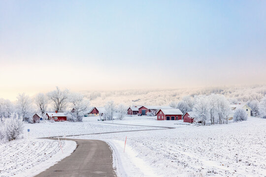 Winding country road to a village in the countryside on a cold winter day