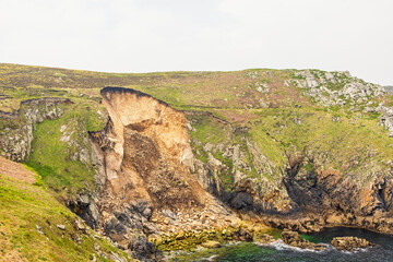 Rockslide at a bay at a rocky coast