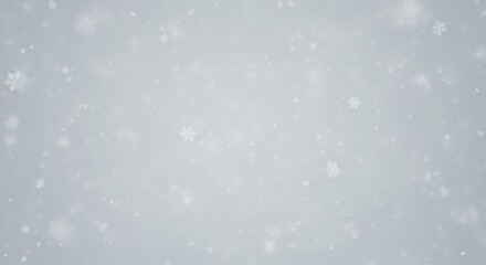 Fototapeta premium A serene, soft, and slightly blurred image of a gentle snowfall against a light gray background.