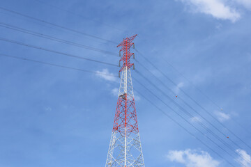 High-Voltage Transmission Tower Against Clear Blue Sky
