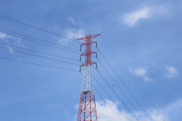 High-Voltage Transmission Tower Against Clear Blue Sky