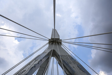 Cable-Stayed Bridge Pylon Viewed from Below Against Blue Sky