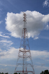 High-Voltage Transmission Tower Against Clear Blue Sky