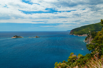 View from top of cliff to beautiful Adriatic seascape near Petrovac, Montenegro. Beautiful coast, rock, and island in sea