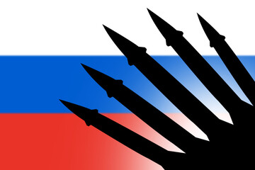 Obraz premium Silhouette of rockets against Russia flag background. Symbol of military power.