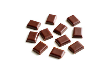 Pieces of tasty chocolate isolated on white
