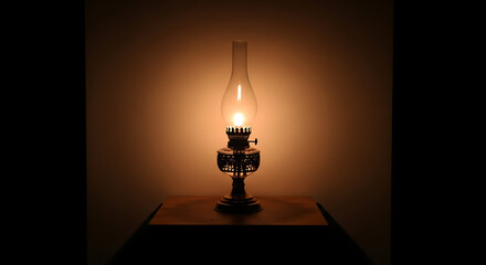 A vintage kerosene oil lamp glowing brightly with a warm flame in a dark, moody setting