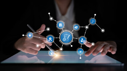 A businessperson engages with a digital screen filled with symbols representing technology and innovation. A modern workspace showcases future trends and connectivity. Tessel