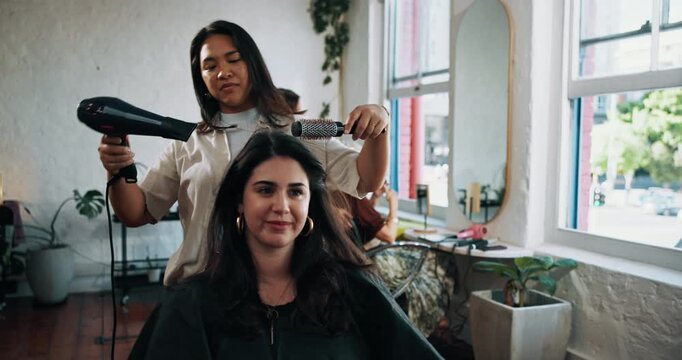 Woman, brush and hairdryer with grooming at salon, services and treatment with service at shop. People, appliance and equipment for hairdresser, stylist or appointment for makeover at beauty parlor