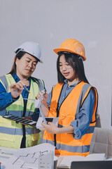 Architects and engineers working collaboratively on construction project