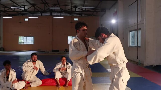judo player cheering loudly while watching the fight
