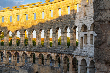 The Roman Amphitheatre in Pula (Pula Arena) in Istria region of Croatia early in morning sunrise...
